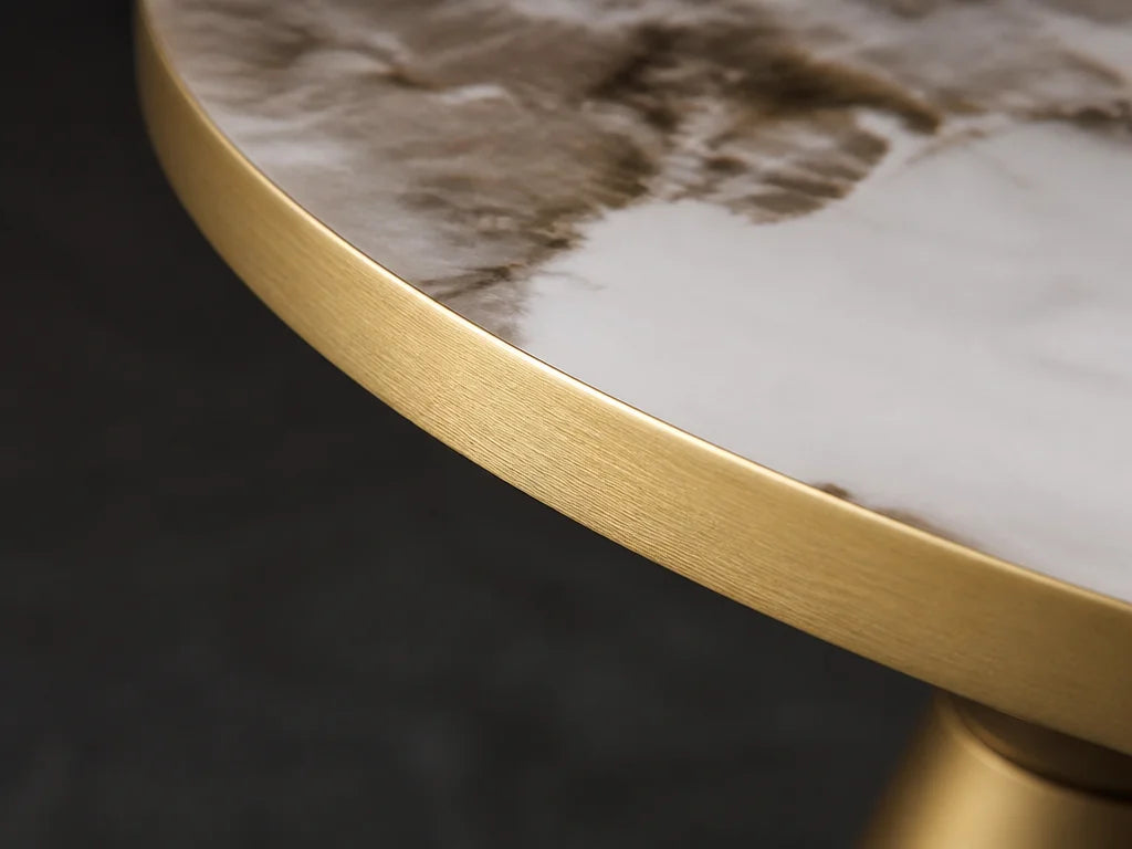 4:3 macro detail of the golden metal rim and the junction with the stone top on the Kidoludo Table B
